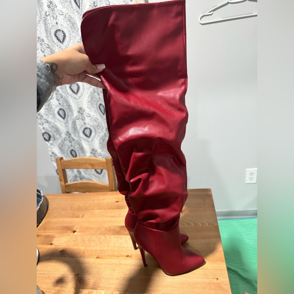 Red knee length boots
